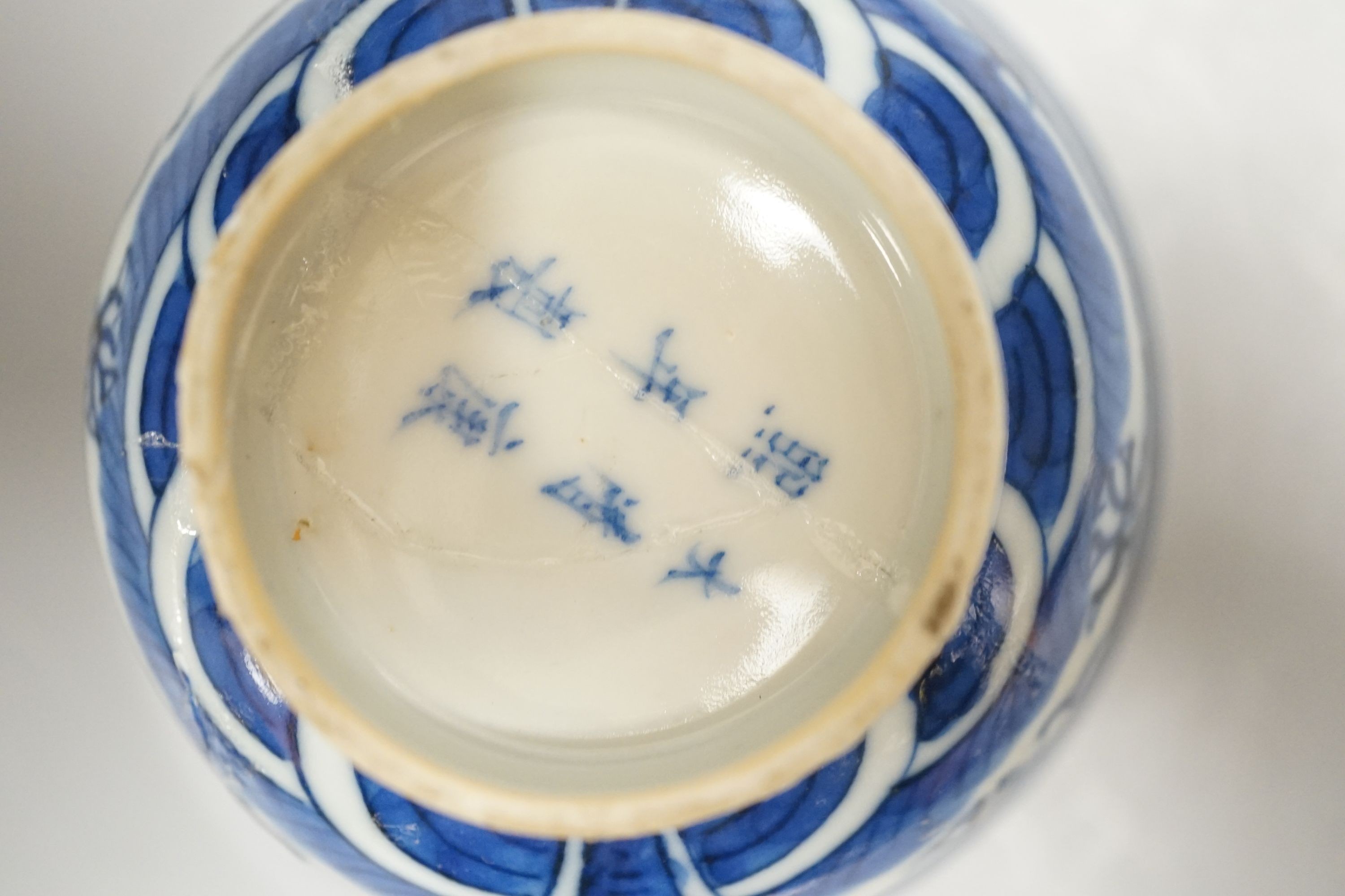 A 19th century Chinese famille rose bowl and saucer, a blue and white tea bowl on stand, a hardstone carving and three 18th century blue and white plates